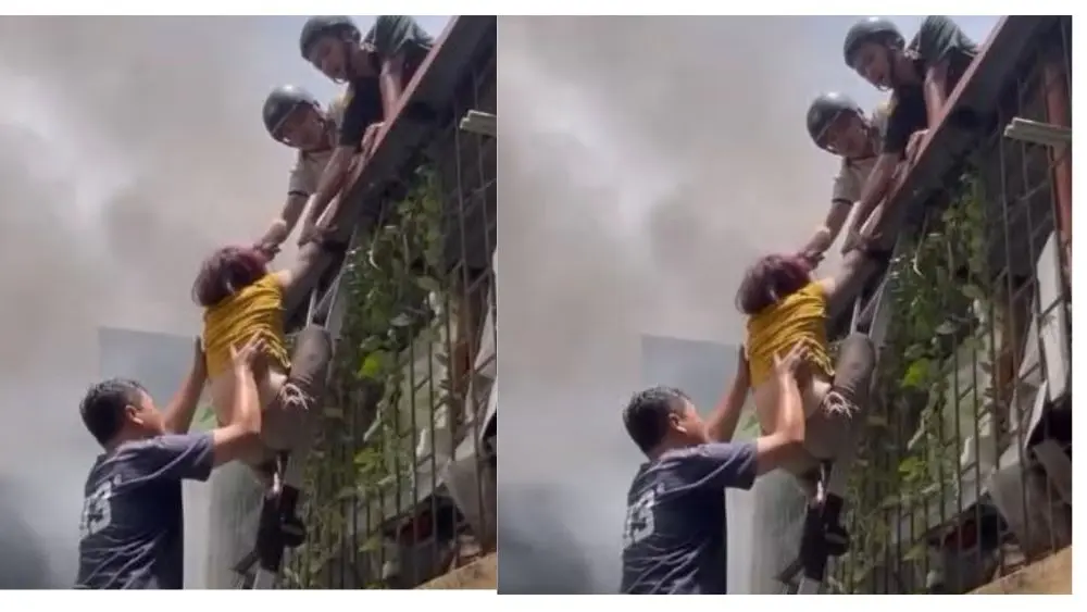 Hà Nội xảy ra cháy nhà cao tầng tại phường Văn Miếu - Quốc Tử Giám, người phụ nữ cùng hai cháu bé được lực lượng chức năng giải cứu an toàn.